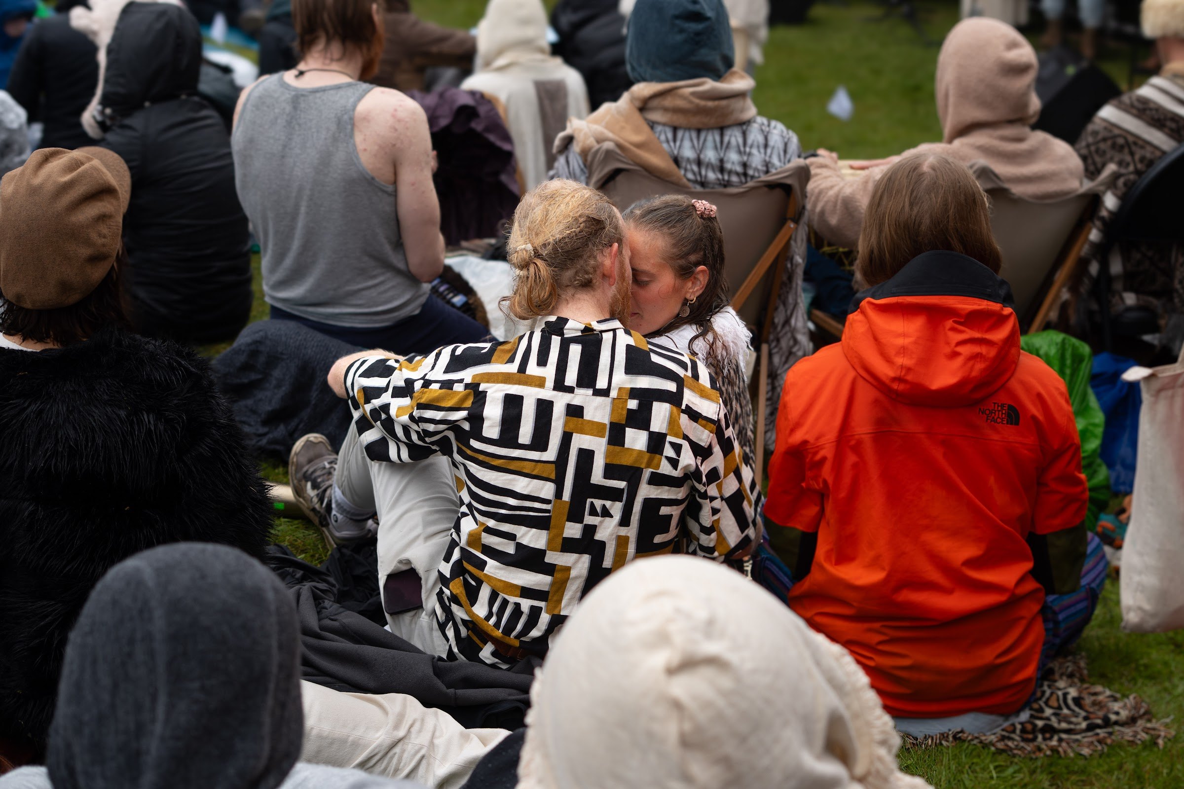 Two friends forehead to forehead in the ceremony crowd, Iceland Eclipse 2026